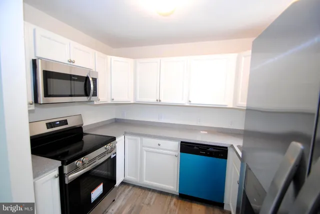 a kitchen with a stove and a microwave