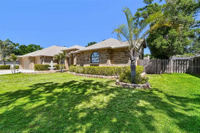 a front view of house with yard and green space