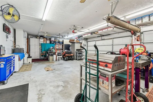 a dining area with a table and chairs
