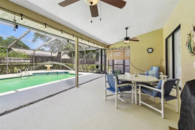 a view of a dining room with furniture wooden floor and chandelier