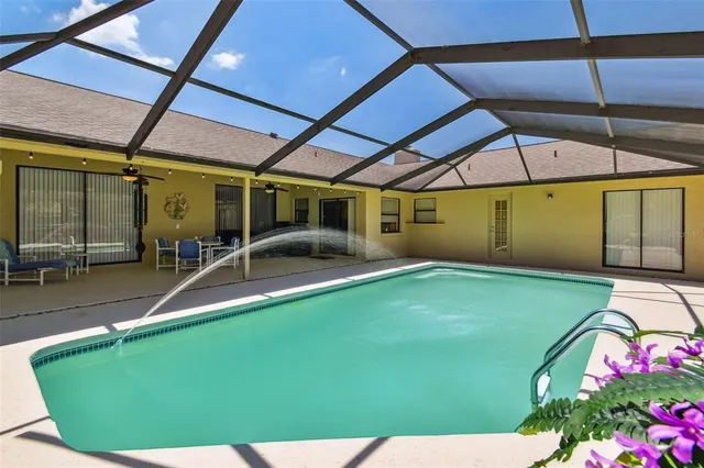a view of a backyard with sitting area