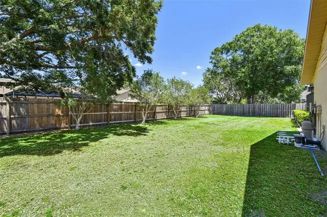 a backyard of a house with lots of green space