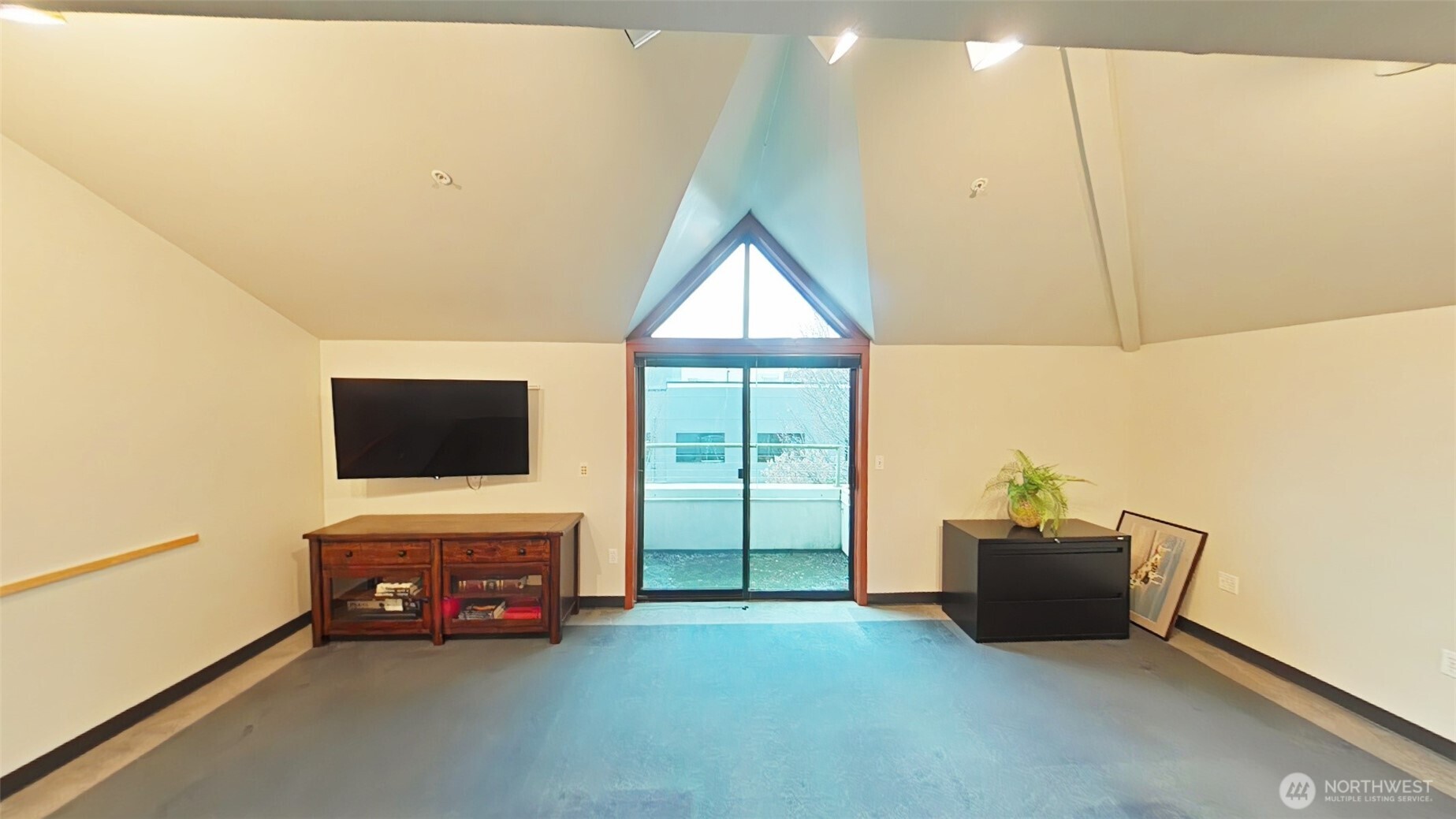 110 James Street, Unit 300 Edmonds, WA 98020 - Photo 2 of 9 a living room with furniture and a flat screen tv
