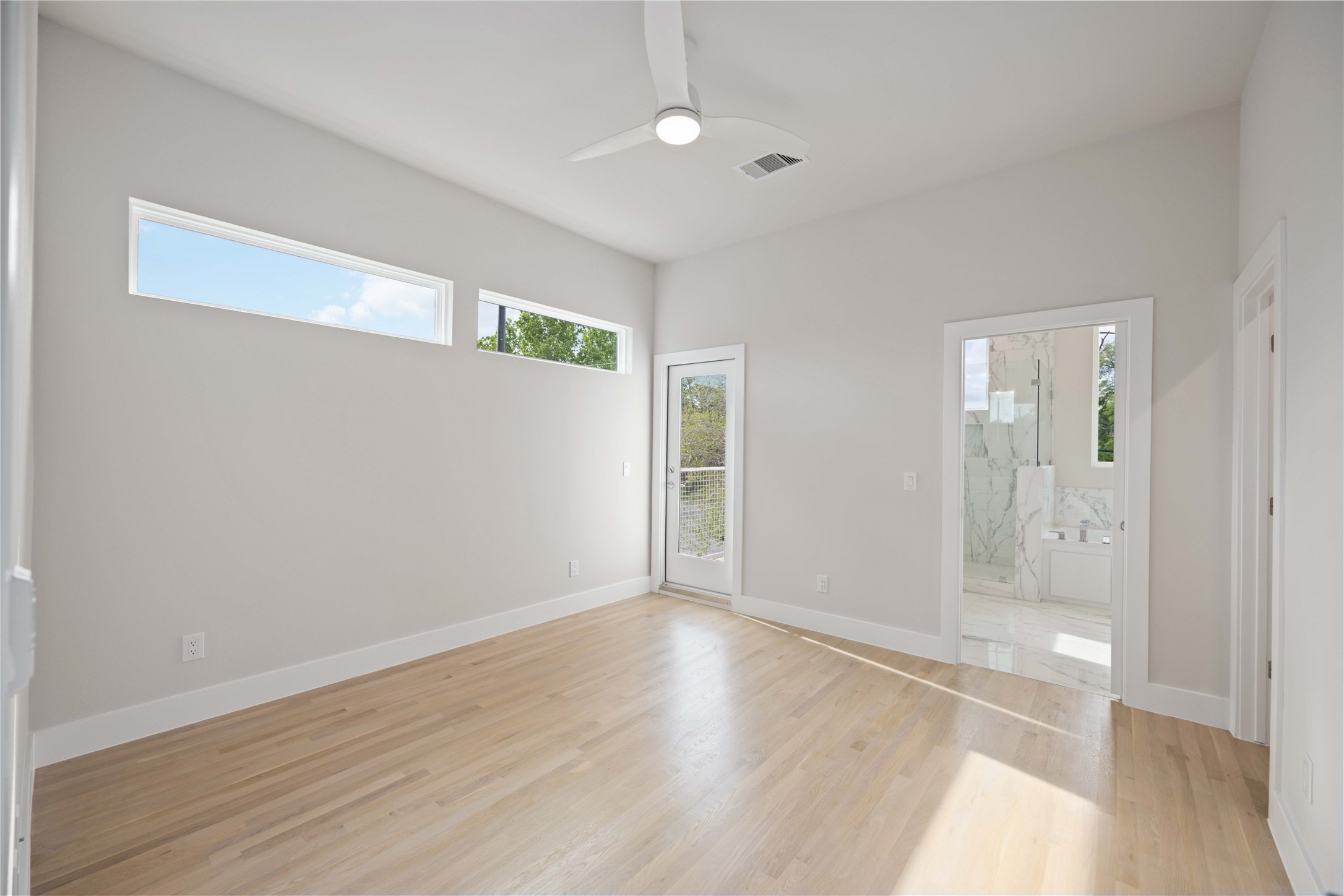 5314 Suez Street Houston, TX 77020 - Photo 18 of 27 an empty room with wooden floor and windows