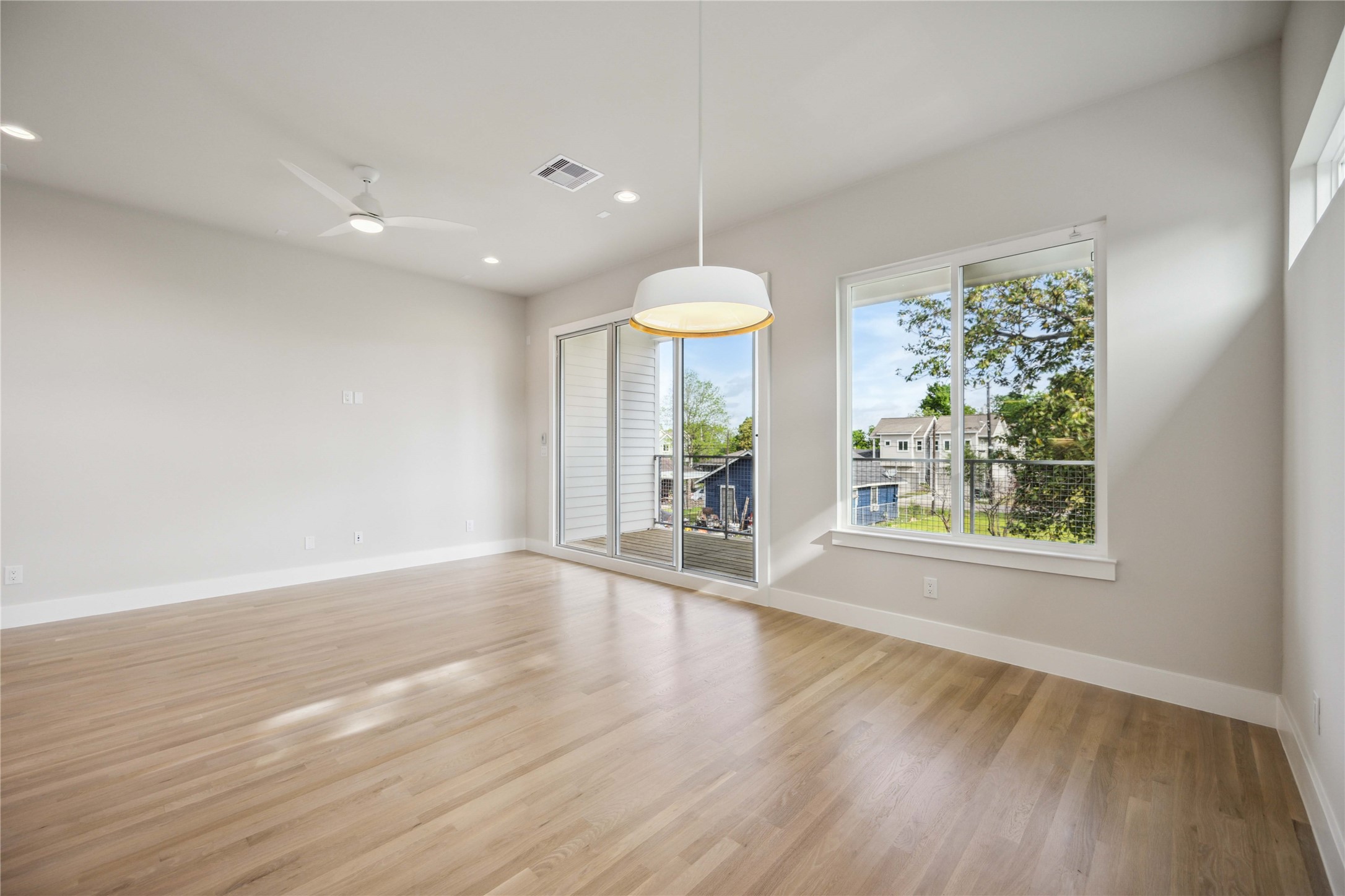 5314 Suez Street Houston, TX 77020 - Photo 9 of 27 wooden floor in an empty room with a window