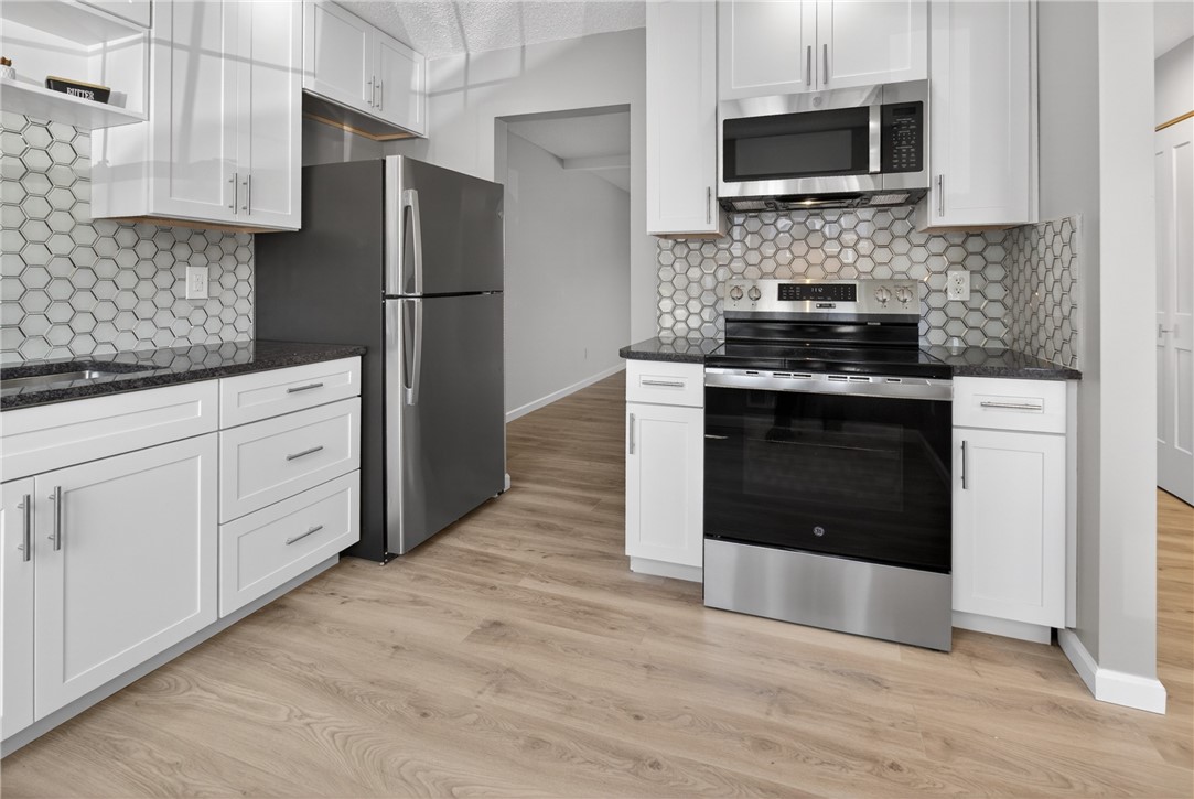 561 French Road Brighton, NY 14618 - Photo 4 of 45 NEW THOUGHTFULLY-APPOINTED KITCHEN W/ GRANITE COUN