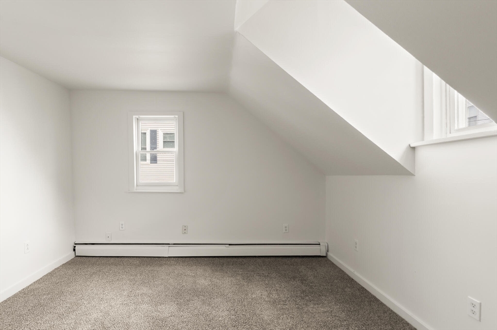 22 Taylor Street, Unit 1 Gloucester, MA 01930 - Photo 19 of 31 a view of an empty room with a window