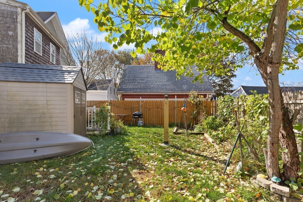 22 Taylor Street, Unit 1 Gloucester, MA 01930 - Photo 20 of 31 a backyard of a house with lots of green space