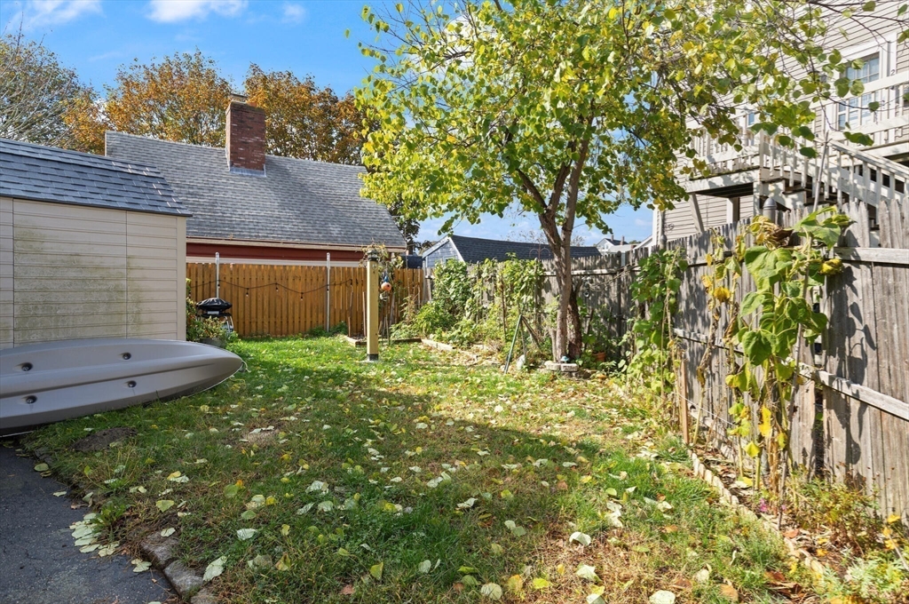 22 Taylor Street, Unit 1 Gloucester, MA 01930 - Photo 21 of 31 a front view of a house with garden