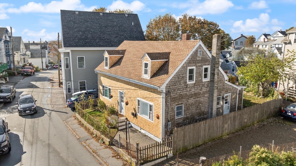 22 Taylor Street, Unit 1 Gloucester, MA 01930 - Photo 25 of 31 a view of a house with many windows