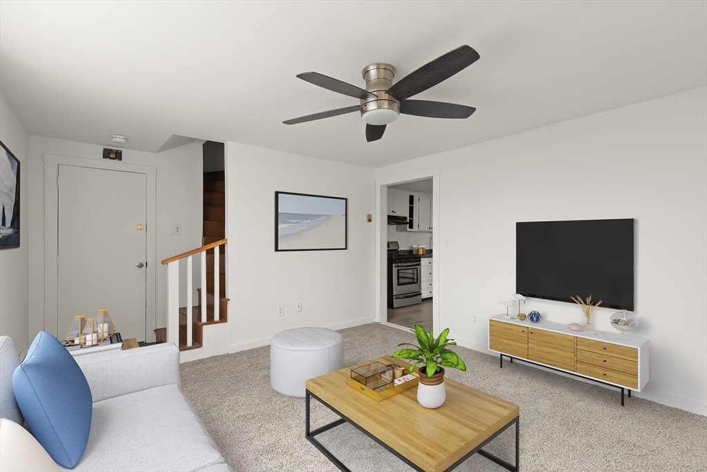 22 Taylor Street, Unit 1 Gloucester, MA 01930 - Photo 3 of 31 a living room with furniture and a flat screen tv