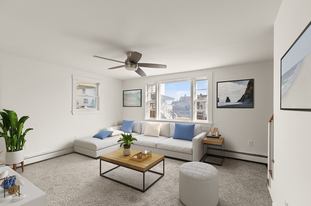 22 Taylor Street, Unit 1 Gloucester, MA 01930 - Photo 4 of 31 a living room with furniture and a potted plant