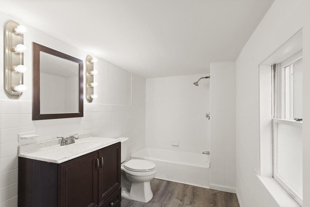 22 Taylor Street, Unit 1 Gloucester, MA 01930 - Photo 10 of 31 a bathroom with a sink a toilet and shower