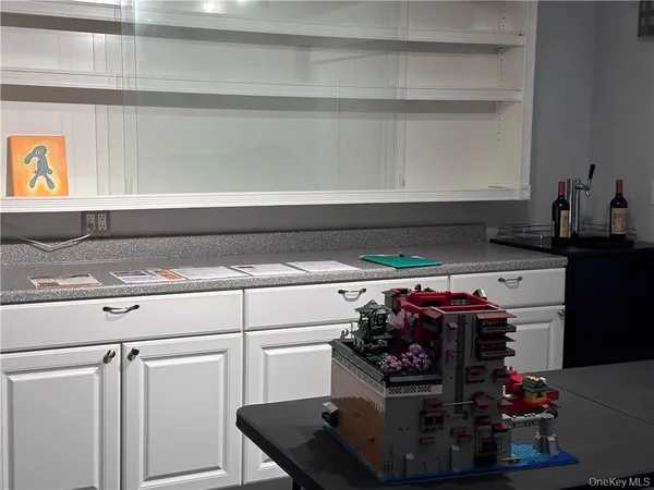 a kitchen with a stove and cabinets