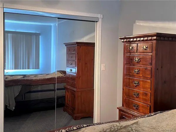 a room that has a dresser in it