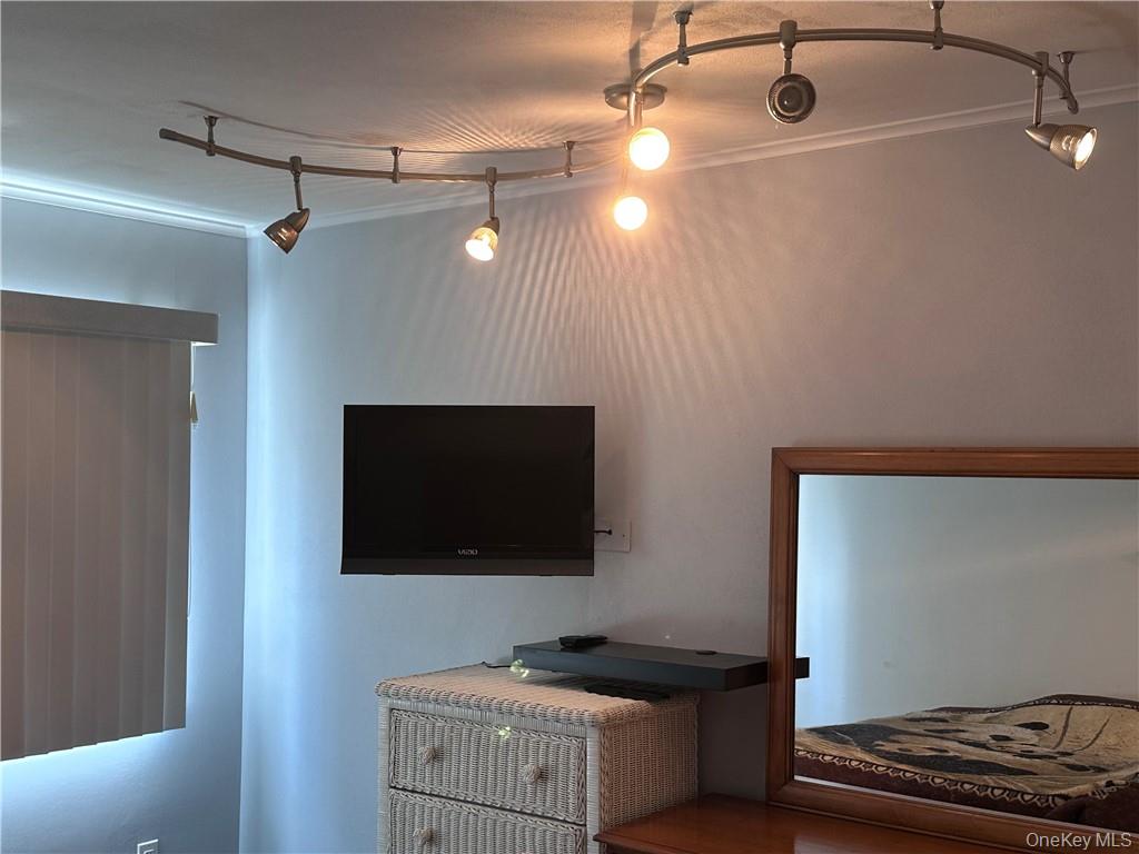 407 Old Mill Road Southfields, NY 10975 - Photo 15 of 29 a bedroom with a bed and a flat screen tv
