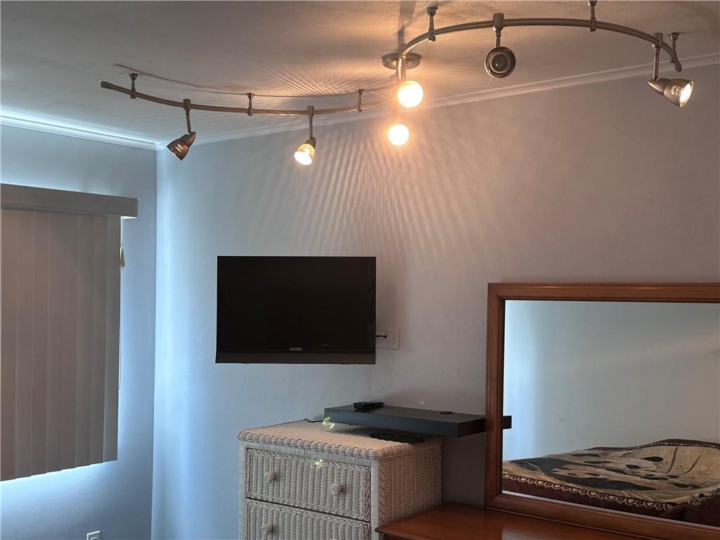 407 Old Mill Road Southfields, NY 10975 - Photo 15 of 29 Bedroom with custom window treatments. crown molding, and track lighting