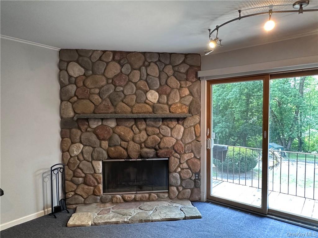 407 Old Mill Road Southfields, NY 10975 - Photo 2 of 29 a room with a fireplace and a wooden floor