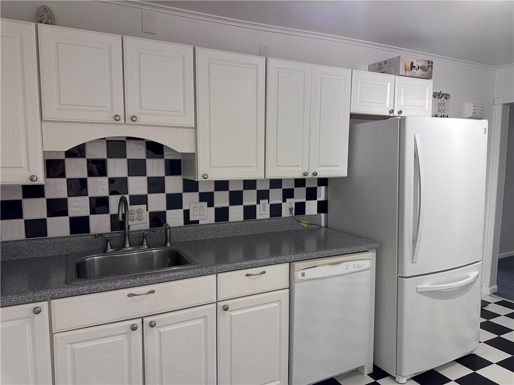 407 Old Mill Road Southfields, NY 10975 - Photo 3 of 29 Kitchen featuring white cabinets, sink, white appliances, and light tile patterned floors
