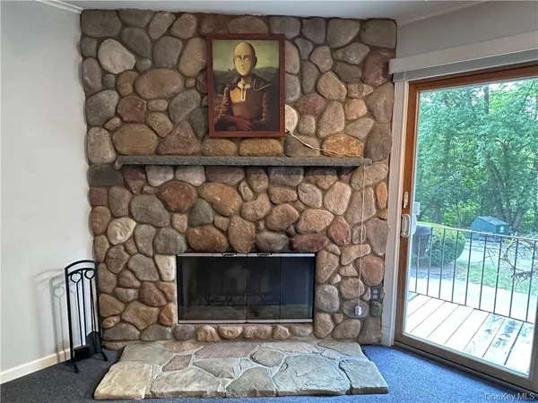 a room with a fireplace and a wooden floor