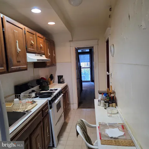a kitchen with stainless steel appliances granite countertop a stove and a sink