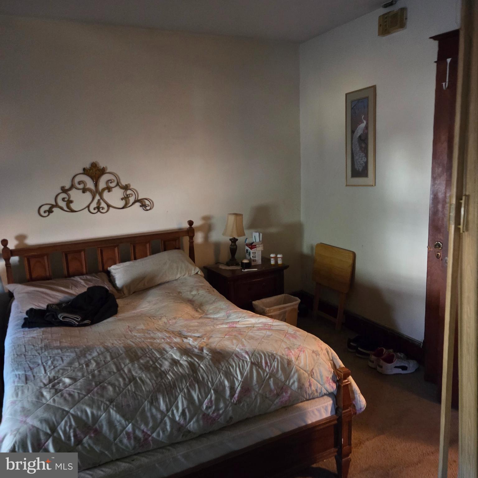 1269 Oates Street Northeast Washington, DC 20002 - Photo 8 of 13 a bedroom with a bed and wooden floor