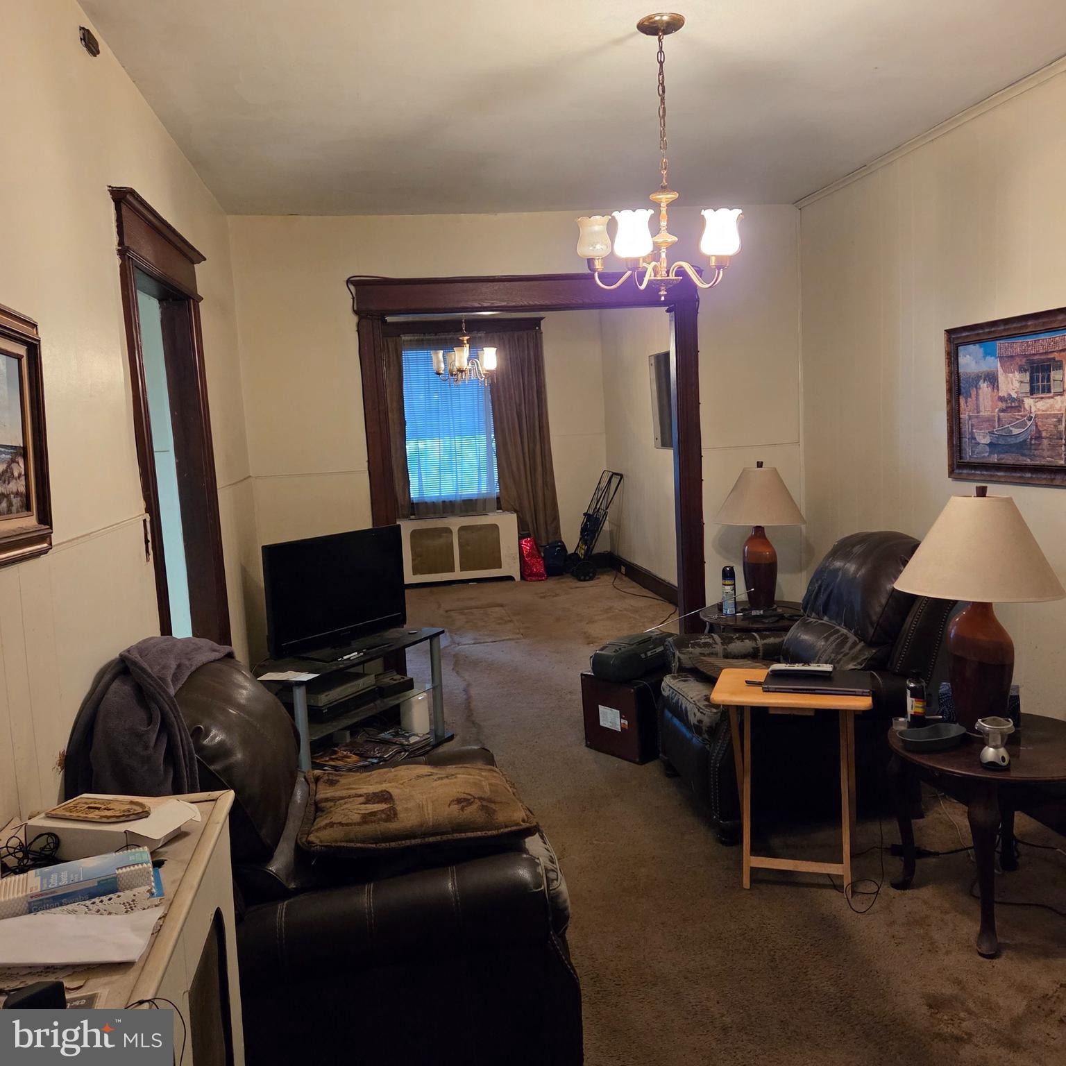 1269 Oates Street Northeast Washington, DC 20002 - Photo 9 of 13 a room with furniture a flat screen tv and a window