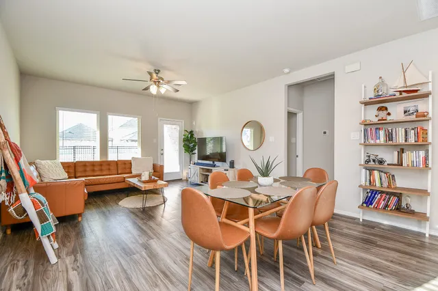 a view of a dining room with furniture window and wooden floor