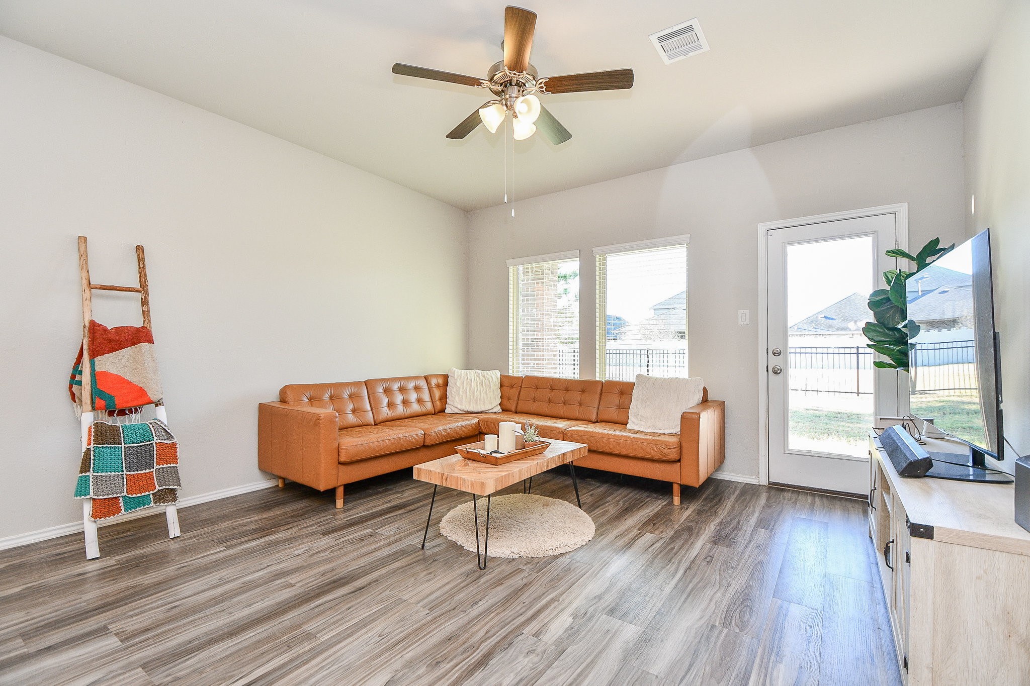 16868 Pink Wintergreen Drive Conroe, TX 77385 - Photo 14 of 32 a living room with furniture and a wooden floor