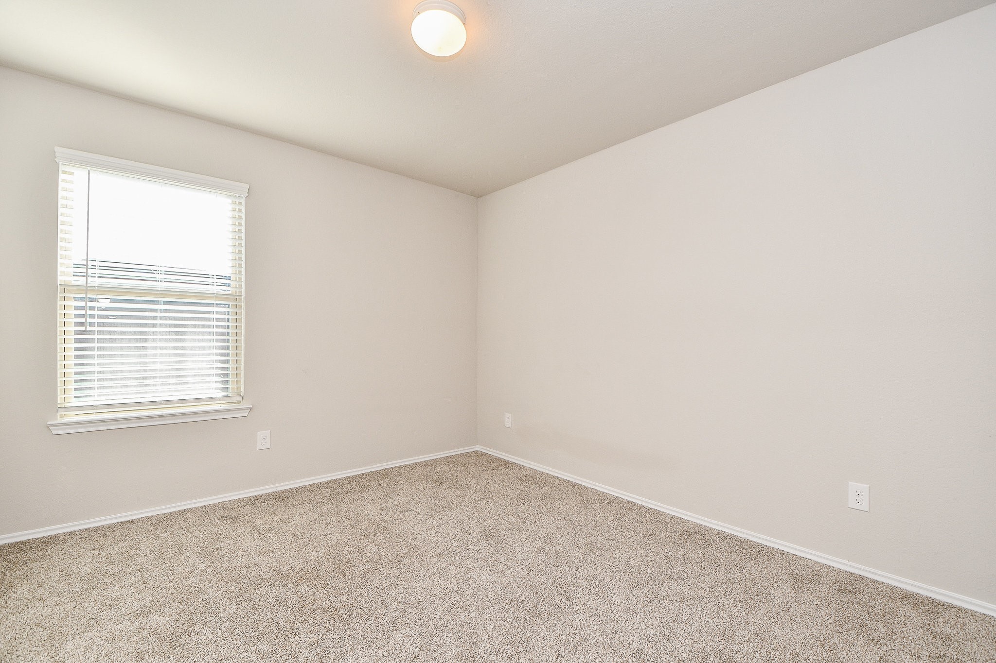16868 Pink Wintergreen Drive Conroe, TX 77385 - Photo 20 of 32 an empty room with a window