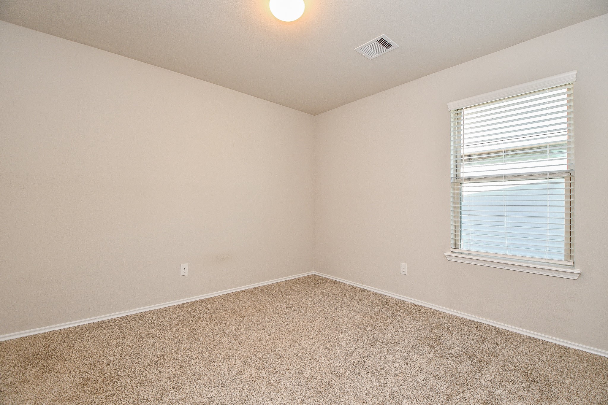 16868 Pink Wintergreen Drive Conroe, TX 77385 - Photo 22 of 32 an empty room with a window