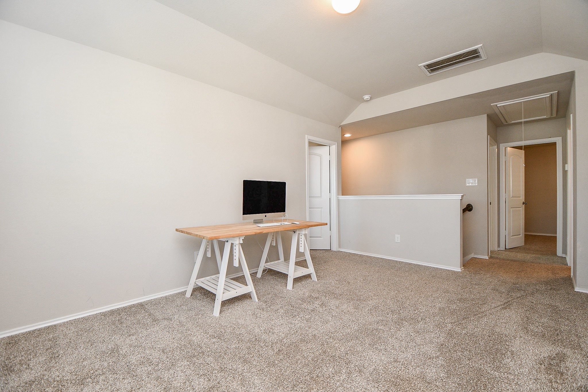 16868 Pink Wintergreen Drive Conroe, TX 77385 - Photo 25 of 32 a view of a livingroom with a chair and a fireplace
