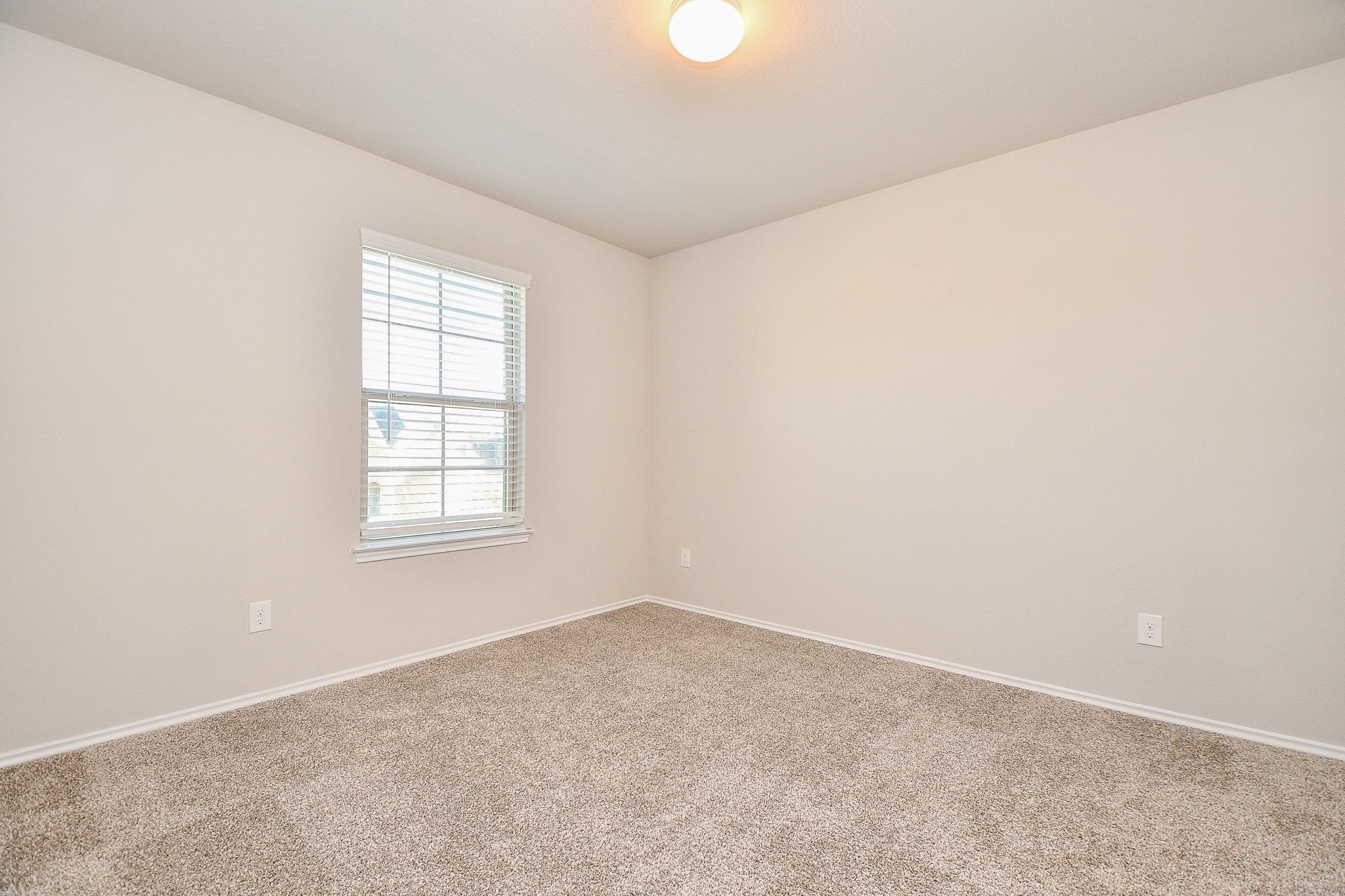 16868 Pink Wintergreen Drive Conroe, TX 77385 - Photo 26 of 32 an empty room with windows