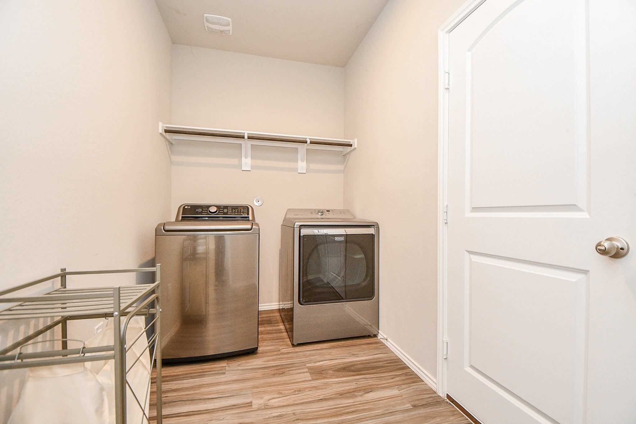 16868 Pink Wintergreen Drive Conroe, TX 77385 - Photo 29 of 32 a view of a storage & utility room with wooden floor