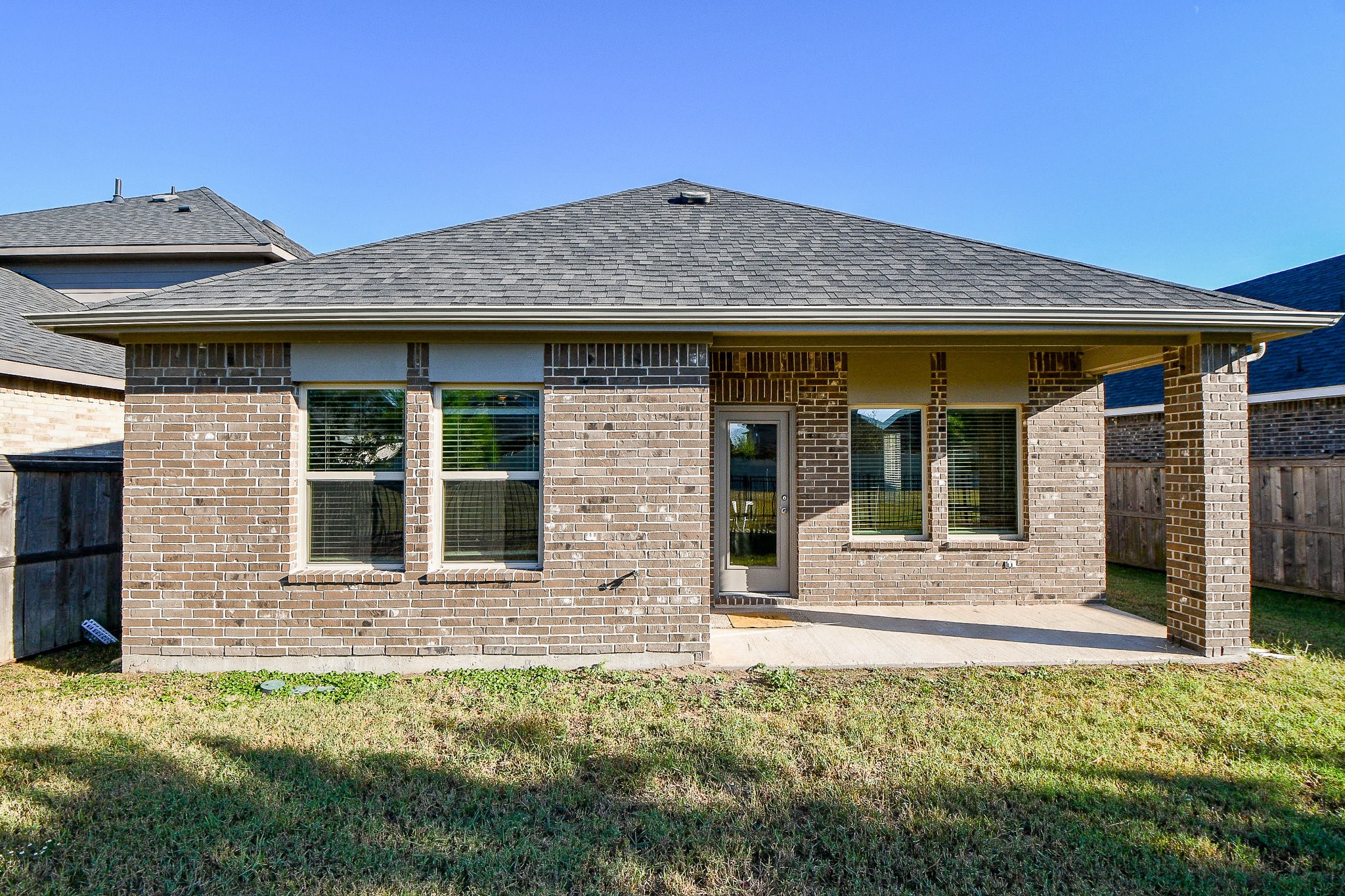 16868 Pink Wintergreen Drive Conroe, TX 77385 - Photo 30 of 32 a front view of a house with a yard