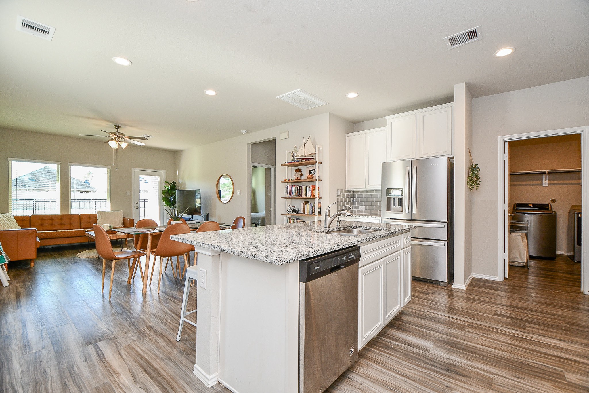 16868 Pink Wintergreen Drive Conroe, TX 77385 - Photo 5 of 32 a kitchen with lots of counter top space and stainless steel appliances