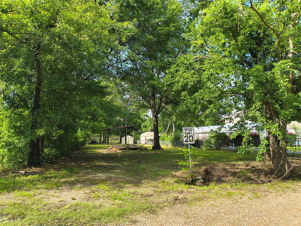 180 Arrowhead Street Mabank, TX 75156 - Photo 6 of 26 a view of a park with large trees