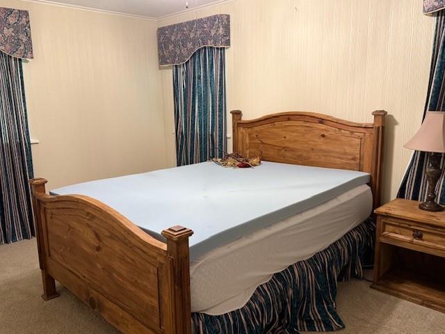 104 Oak Street Homer, LA 71040 - Photo 17 of 29 a bedroom with a bed and dresser