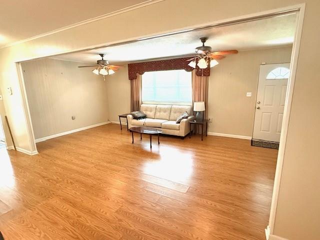 104 Oak Street Homer, LA 71040 - Photo 27 of 29 a living room with furniture and a chandelier