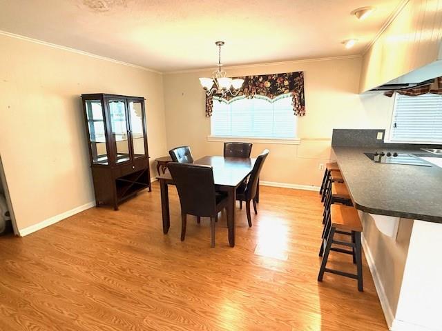 104 Oak Street Homer, LA 71040 - Photo 4 of 29 a view of a dining room with furniture and wooden floor