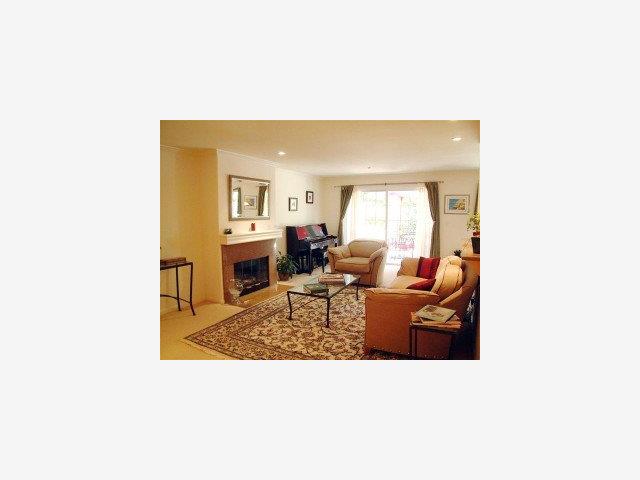 20 Willow Road, Unit 7 Menlo Park, CA 94025 - Photo 4 of 9 a living room with furniture and a fireplace