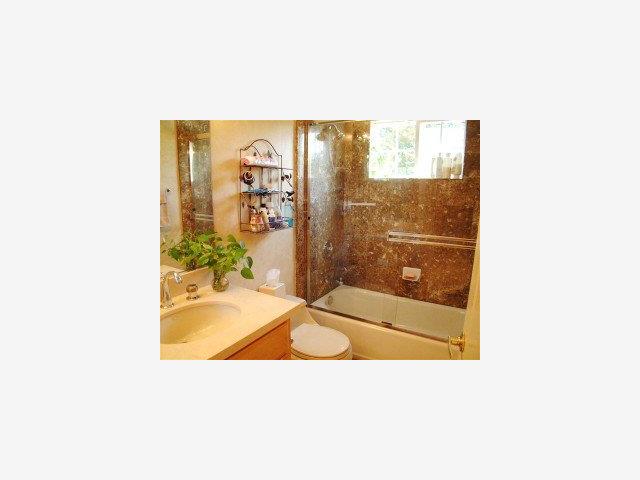 20 Willow Road, Unit 7 Menlo Park, CA 94025 - Photo 8 of 9 a picture of a living room with a floor to ceiling window