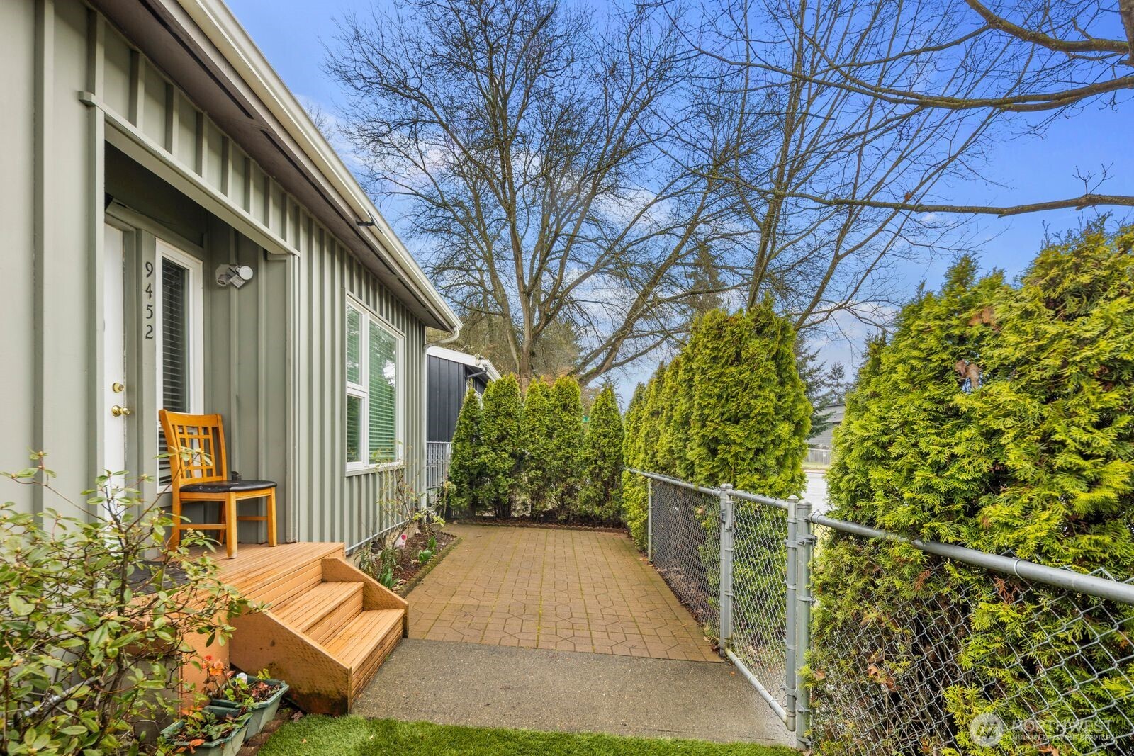9452 25th Avenue Southwest Seattle, WA 98106 - Photo 6 of 37 a backyard of a house with lots of green space