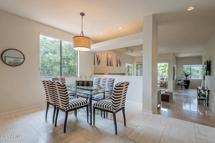 7700 East Gainey Ranch Road, Unit 153 Scottsdale, AZ 85258 - Photo 9 of 24 a dining room with furniture and window