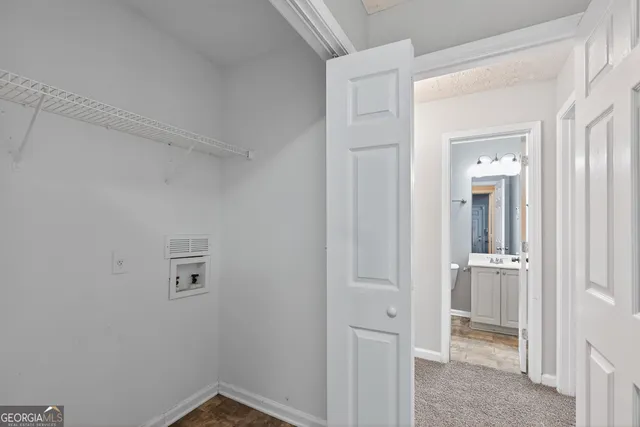 a view of a hallway with closet