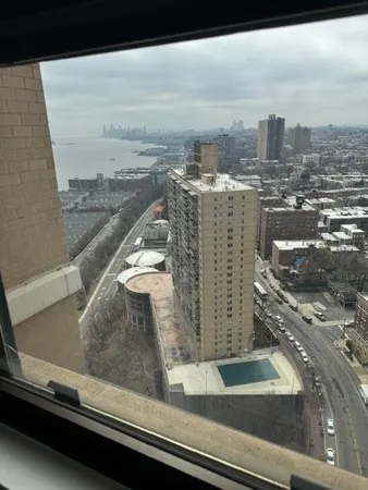 a view of roof with city view