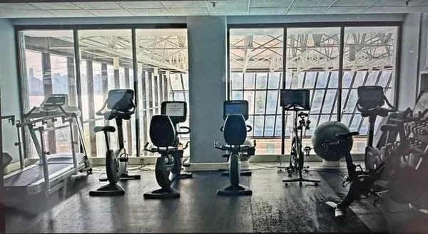a bedroom with gym equipment