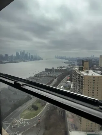 a view of roof with city view
