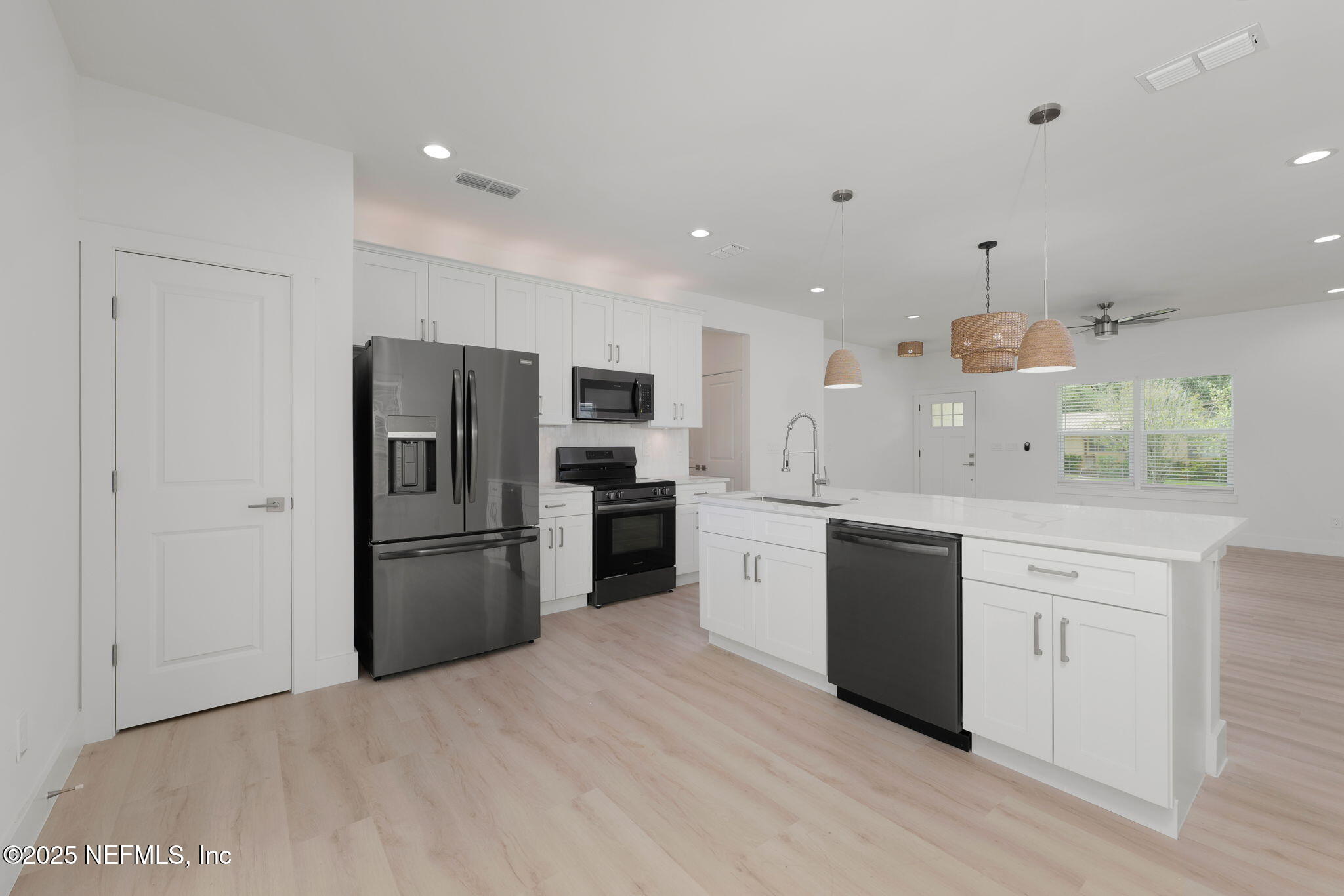 609 Twenty Second Street St. Augustine, FL 32084 - Photo 12 of 34 a kitchen with a refrigerator and a sink