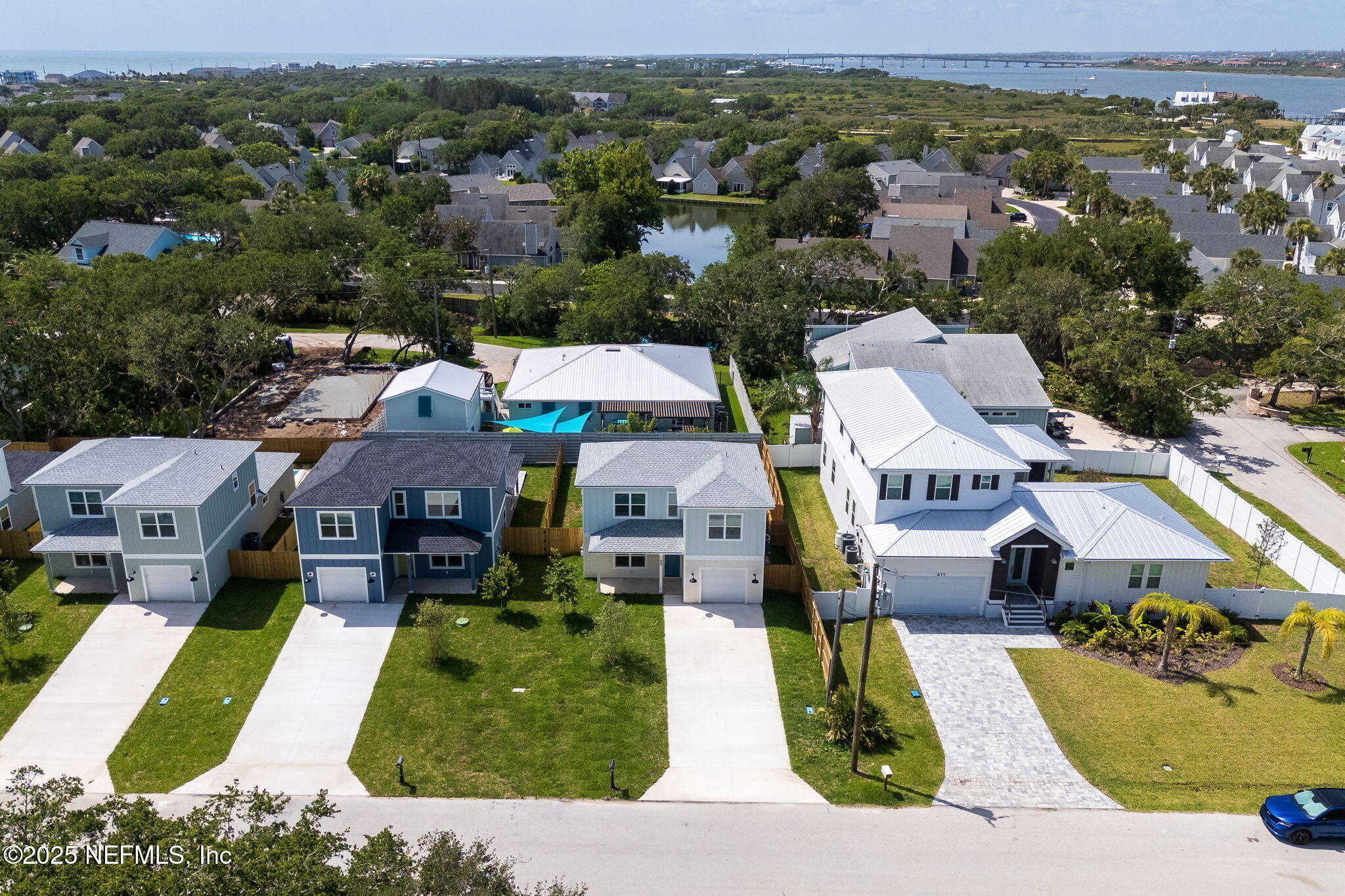 609 Twenty Second Street St. Augustine, FL 32084 - Photo 3 of 34 an aerial view of multiple houses with yard